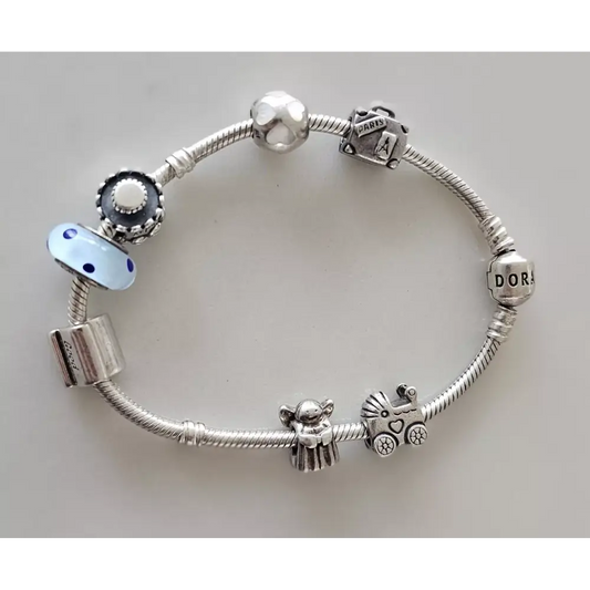 Silver bracelet with various charms 