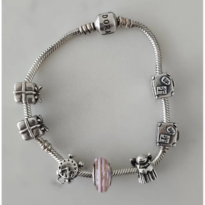 Silver bracelet with various charms 