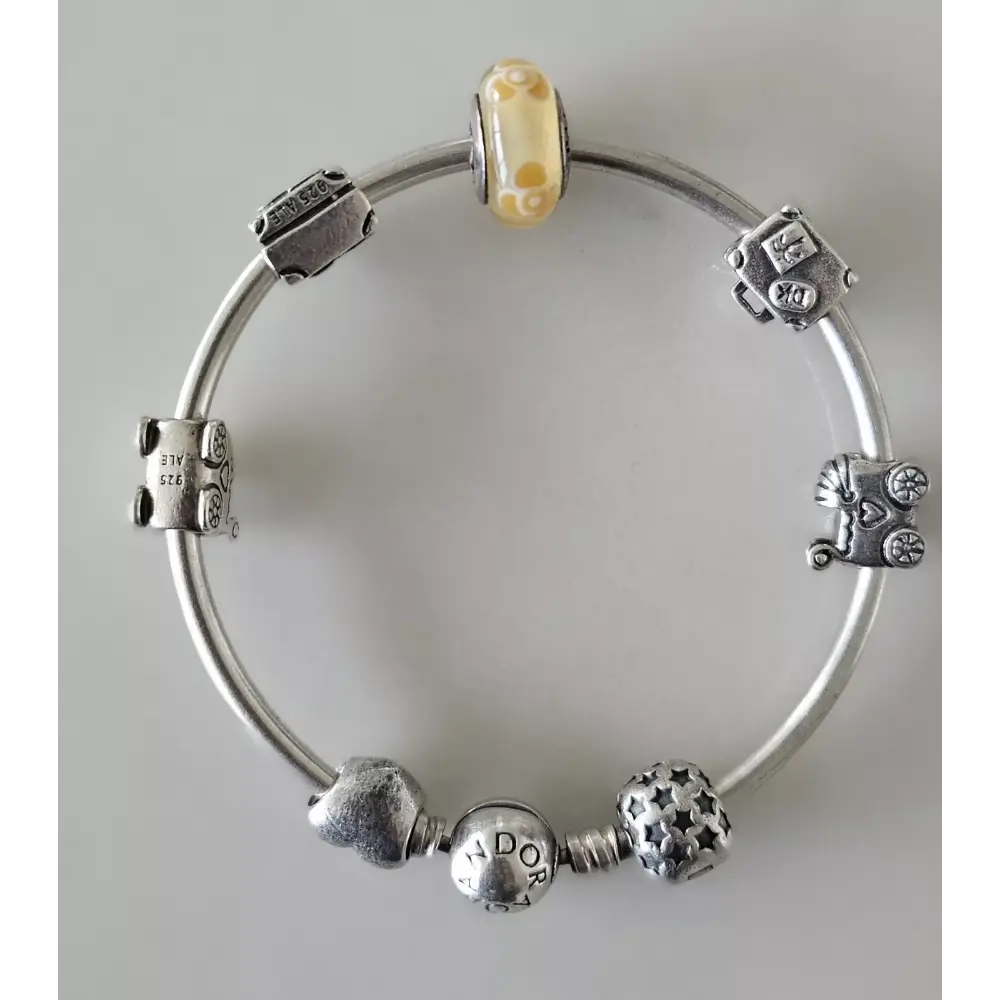 Silver bracelet with various charms