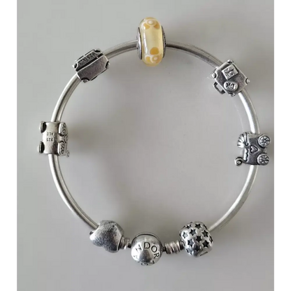Silver bracelet with various charms