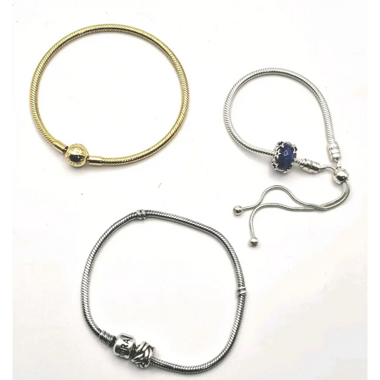 Three bracelets in gold, silver, and a combination of gold and silver
