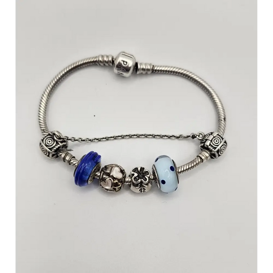 Silver bracelet with various charms