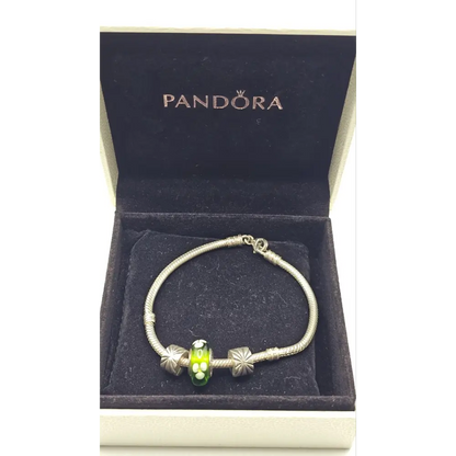 Pandora bracelet with a green charm