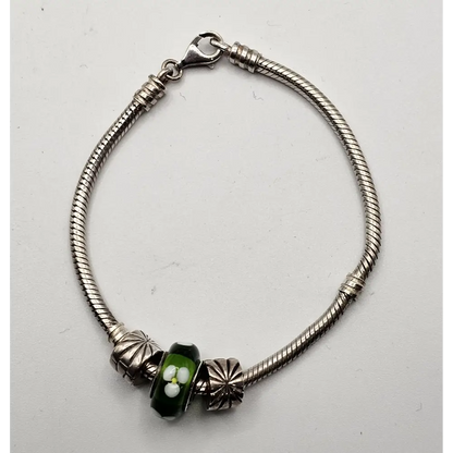 Silver bracelet with a green bead