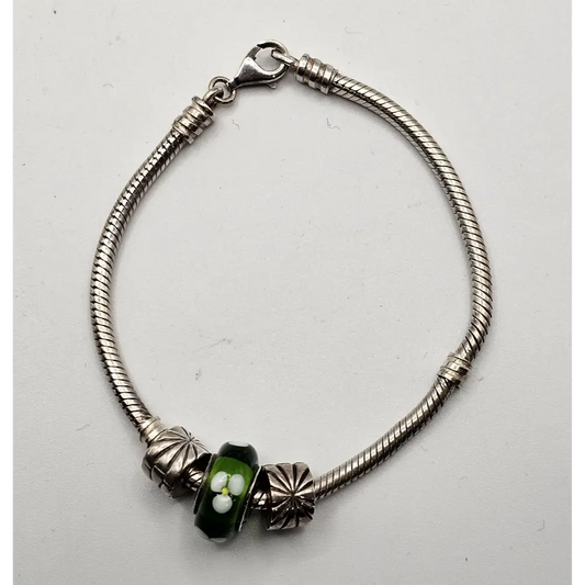 Silver bracelet with a green bead