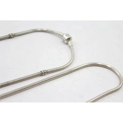 Silver snake chain necklace on a white background