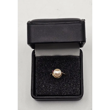 Pearl ring in a black jewelry box 