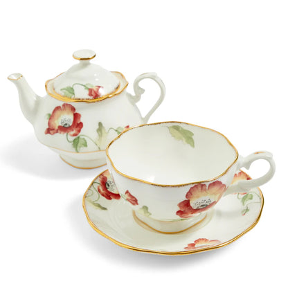 Tea set with floral design on a white background