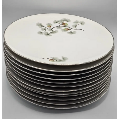 Stack of decorative plates with nature-themed design