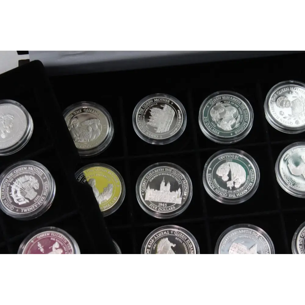 Collection of coins in a display case with various designs