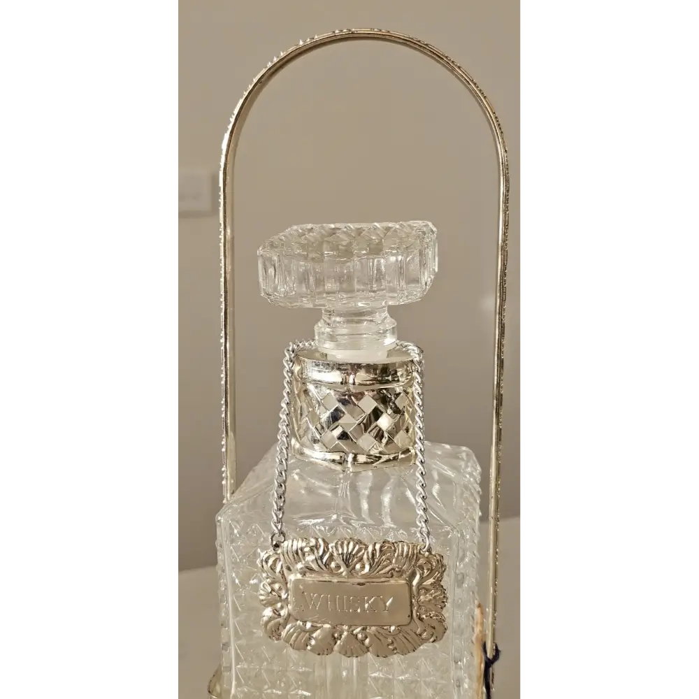 Close-up of the "Made in England" hallmark and silver plating on the Queen Victoria decanter set.