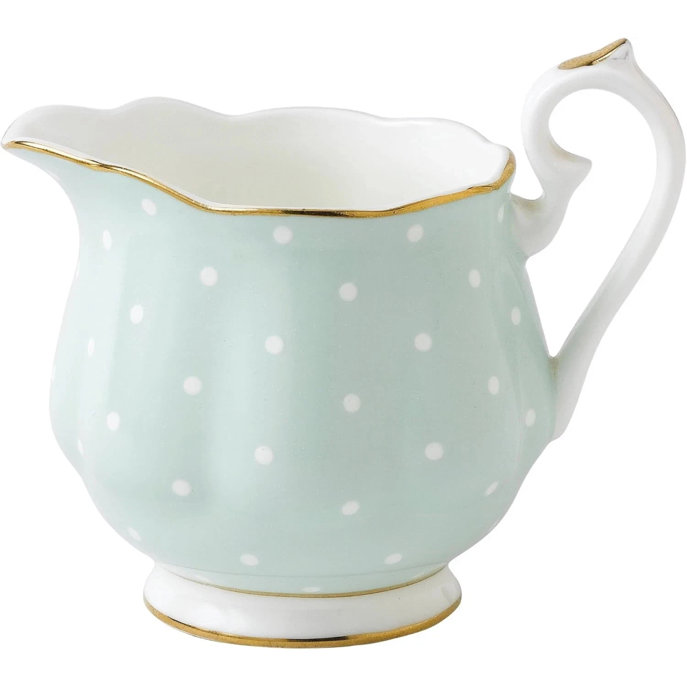 Porcelain creamer with white polka dots and gold accents 