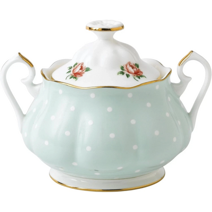 Porcelain sugar bowl with floral design and polka dots
