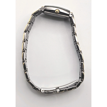 Silver watch on white surface