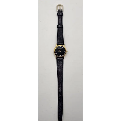 Wristwatch with black strap and gold case 