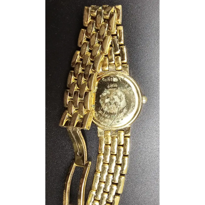 Gold wristwatch with a textured band