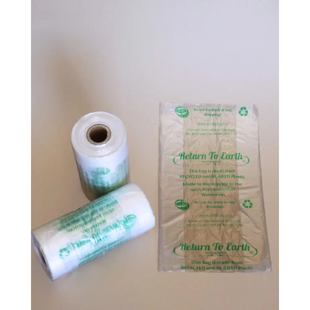 Two rolls of 'Return To Earth' paper on a plain background