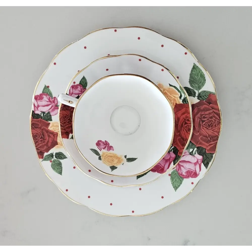 Set of ceramic plates with floral design on a gray background