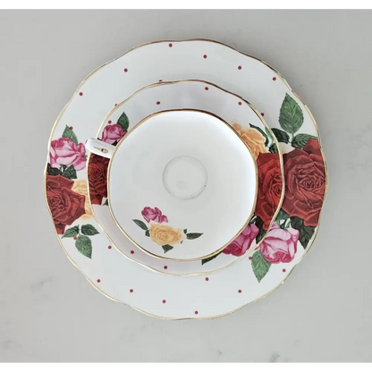 Set of ceramic plates with floral design on a gray background