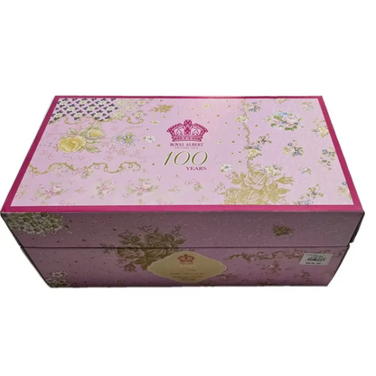Decorative box with floral patterns and '100 Years' text on a white background