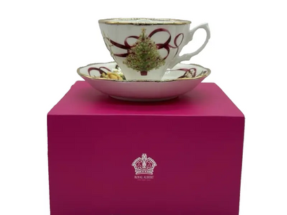 Teacup with decorative design on a pink box featuring Royal Albert logo