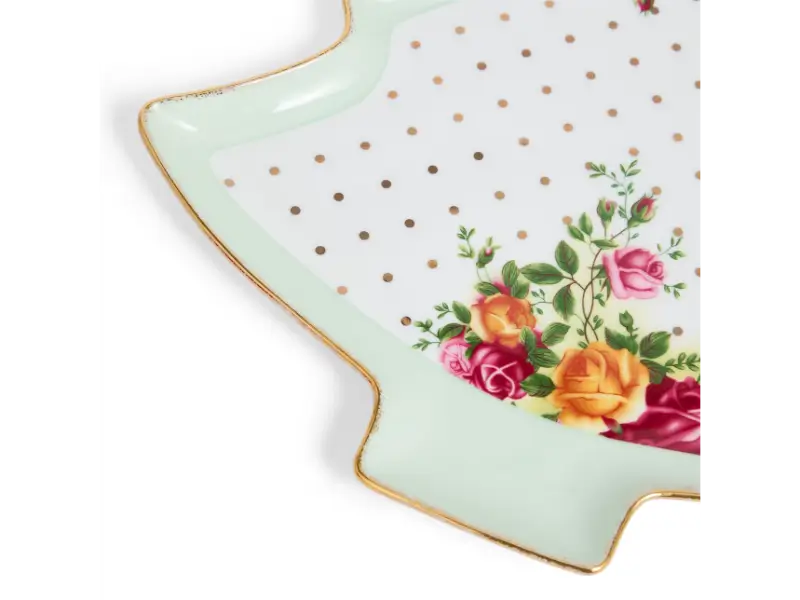 Decorative plate with floral design and polka dots on a white background