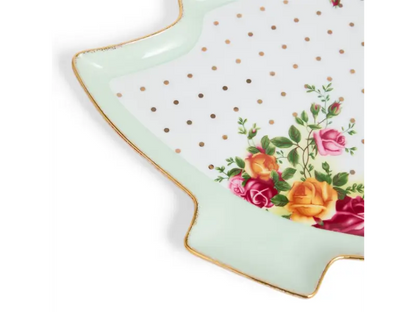 Decorative plate with floral design and polka dots on a white background