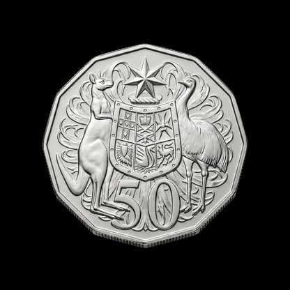 A silver-colored Australian 50 cents coin featuring a kangaroo, emu, and coat of arms, shown against a solid black background.