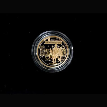 A round gold-toned collectible coin or medallion displayed inside a clear protective capsule, centered on a solid black background from our World & Vintage Coins collection 