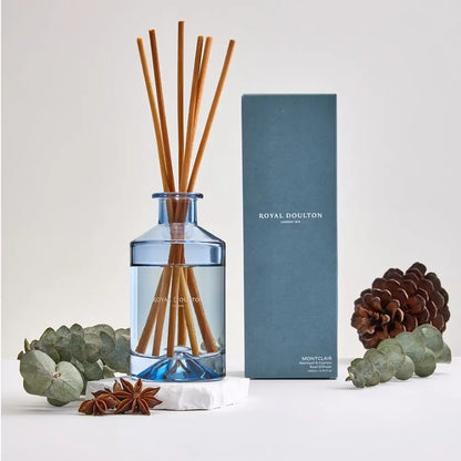Reed diffuser with wooden sticks in a blue bottle