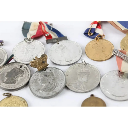 Close-up of antique Royal Medallions featuring Edward VII, Edward VIII, and George V