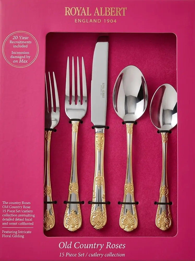 Professional product photograph of a Royal Albert 'Old Country Roses' cutlery set with ornate floral gold-accented handles, displayed in its original vibrant pink presentation box.