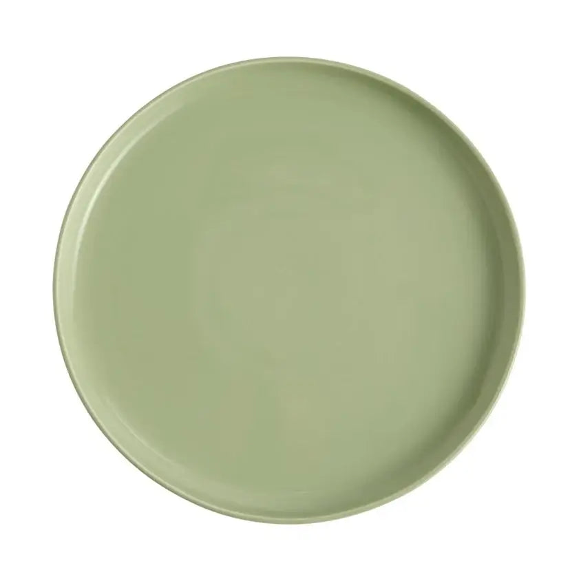 Green ceramic plate on a white background