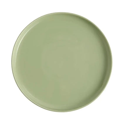 Green ceramic plate on a white background