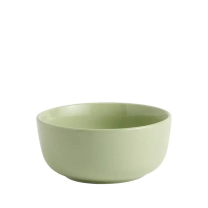 Green ceramic bowl on a white background