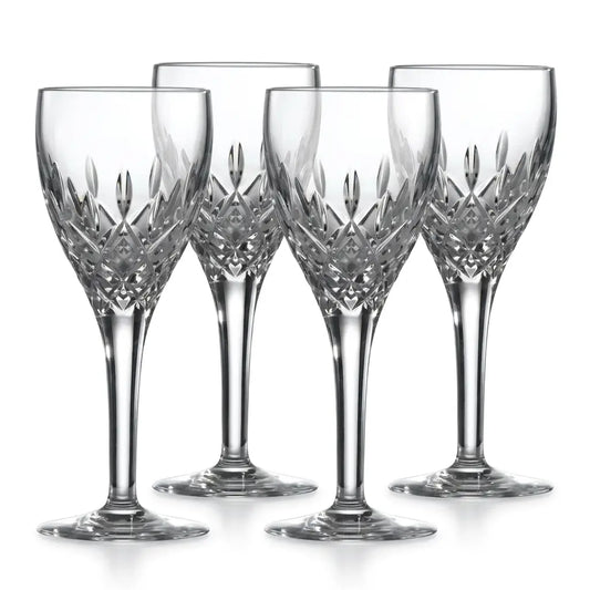 Set of four crystal wine glasses with intricate designs on a white background from our Royal Doulton Collection Australia