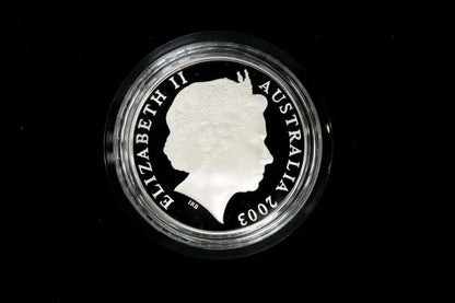 A 2003 Australian Queen Elizabeth II silver coin in a circular protective plastic capsule, shown against a solid black background.