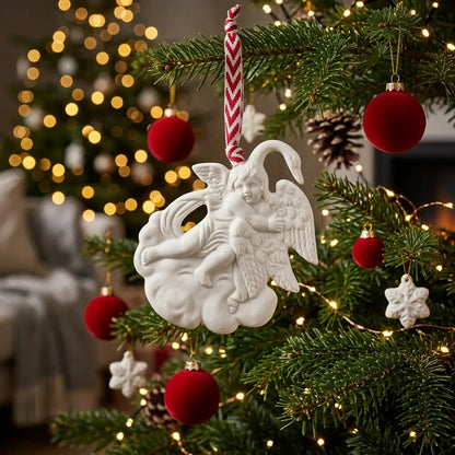 Decorative angel ornament on a Christmas tree with lights and ornaments in the background.