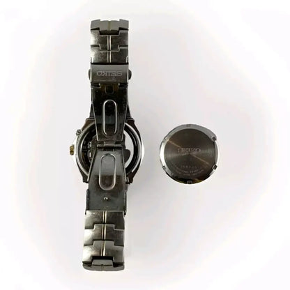 Metallic watch with a detached face