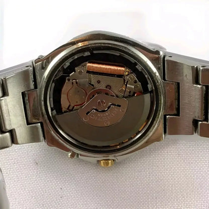 Watch mechanism exposed on a white background