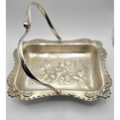 Silver basket with decorative handle