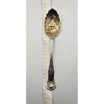 Decorative silver spoon with gold leaf design