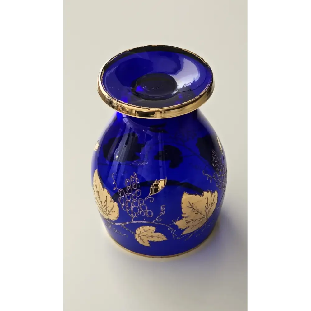 Blue glass vase with gold leaf patterns 
