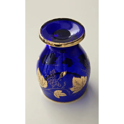 Blue glass vase with gold leaf patterns 