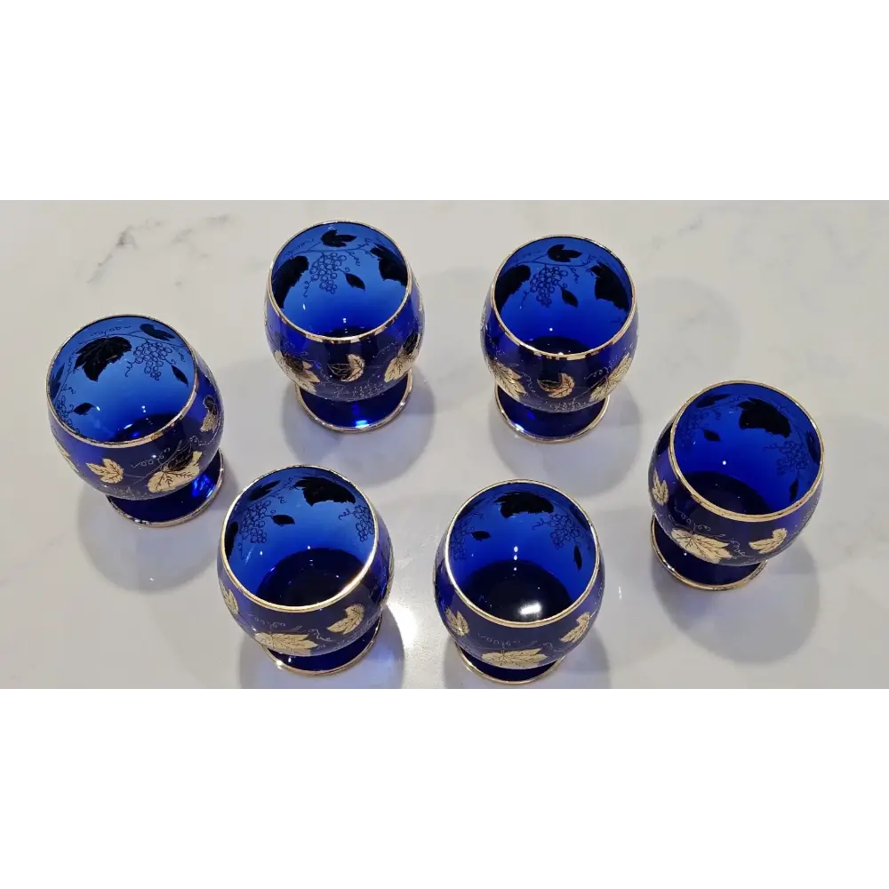 Detailed view of the elegant stem and base of an authentic vintage Bohemian blue crystal goblet.