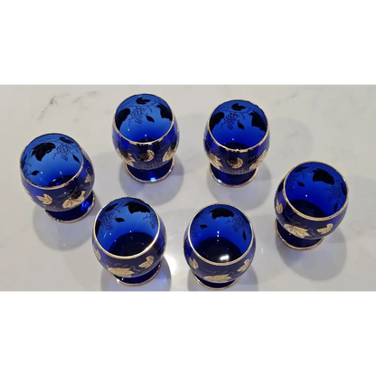 Detailed view of the elegant stem and base of an authentic vintage Bohemian blue crystal goblet.