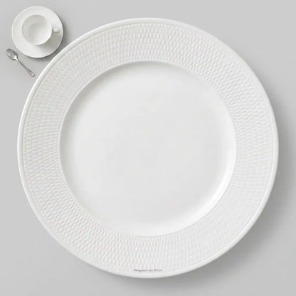 Professional studio shot of a 20.5 cm Wedgwood Gio side plate showing the intricate honeycomb intaglio pattern on the rim and a smooth white finish.