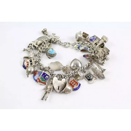Silver charm bracelet with various charms 