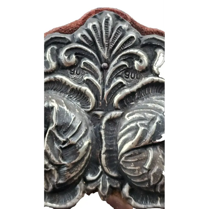 Decorative metal stamp with intricate leaf pattern 
