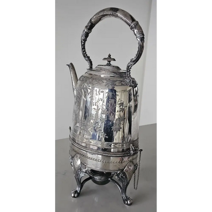 Silver teapot with intricate designs